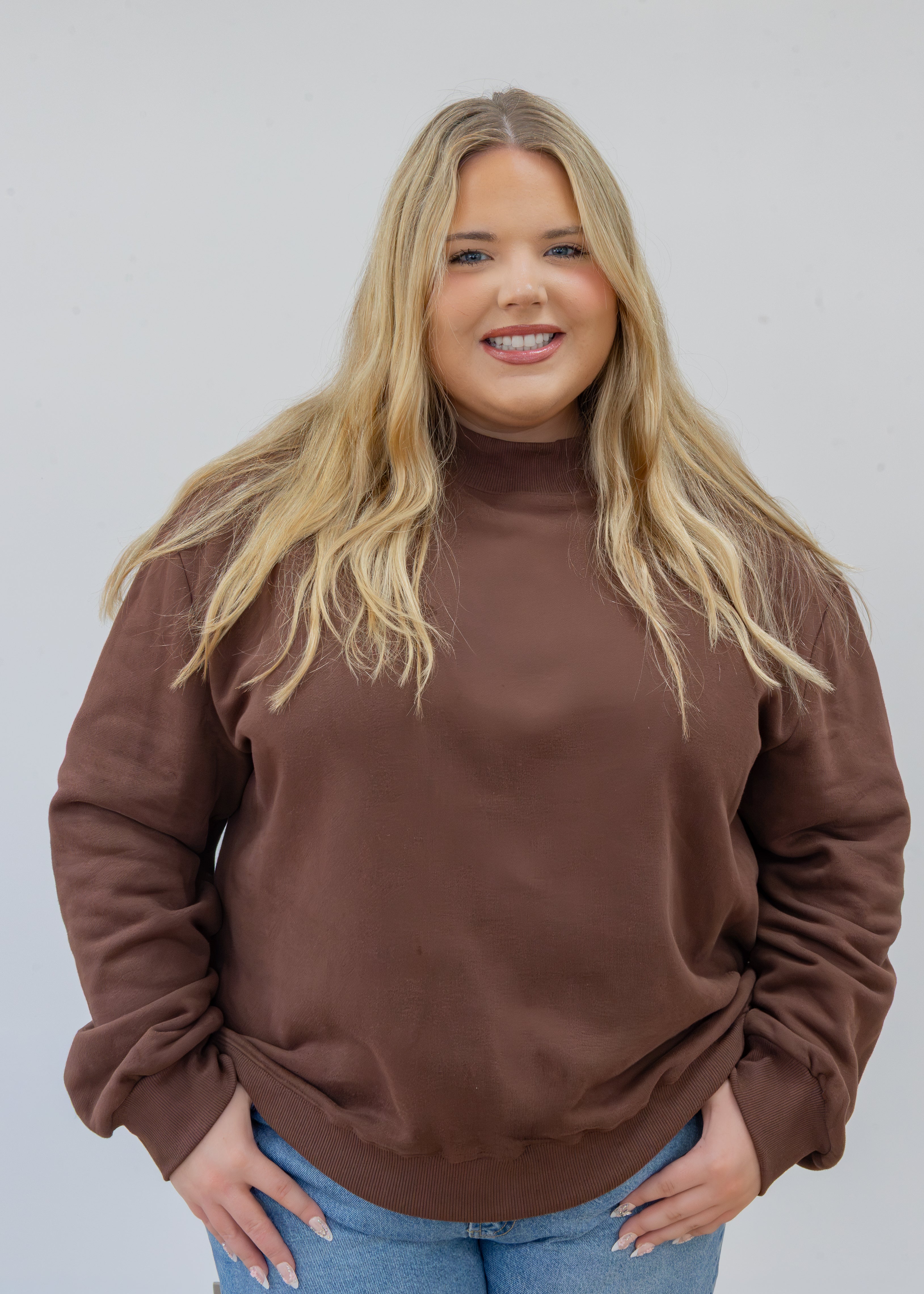 Model in espresso mock neck in 2xl