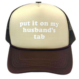 Put It On My Husband's Tab Trucker Hat
