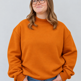 model in s/m pumpkin mock neck