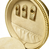 Close-up of gold needlepoint travel jewelry case featuring three earring holders, interior storage pocket, and soft cream lining.