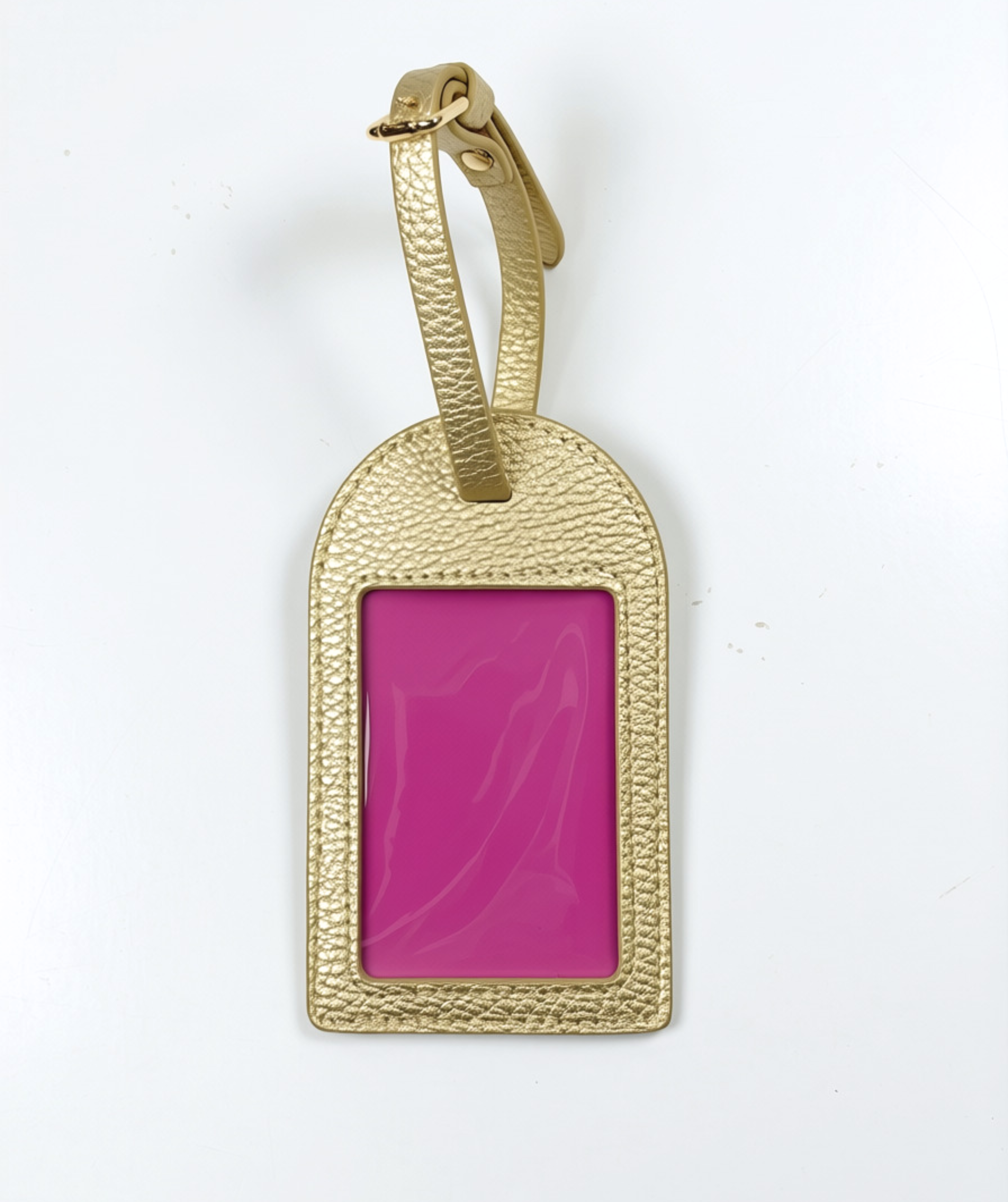 Metallic gold self-finishing needlepoint luggage tag featuring a textured finish, adjustable strap, and rectangular needlepoint window.