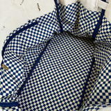 Inside view of the Parker needlepoint tote featuring navy blue and white gingham lining and roomy interior storage.