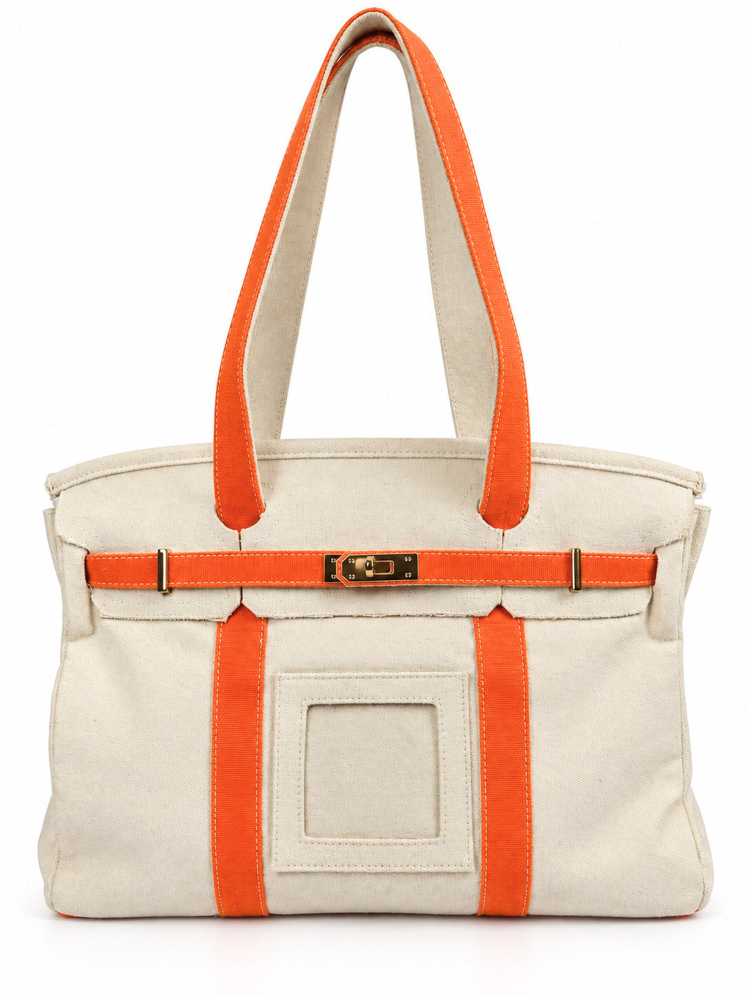Parker self-finishing needlepoint boat tote bag with bright orange straps, cream canvas exterior, gold hardware, and front insert.