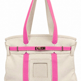 Parker self-finishing needlepoint canvas boat tote bag with bright pink handles, matching trim, gold hardware, and front needlepoint insert.