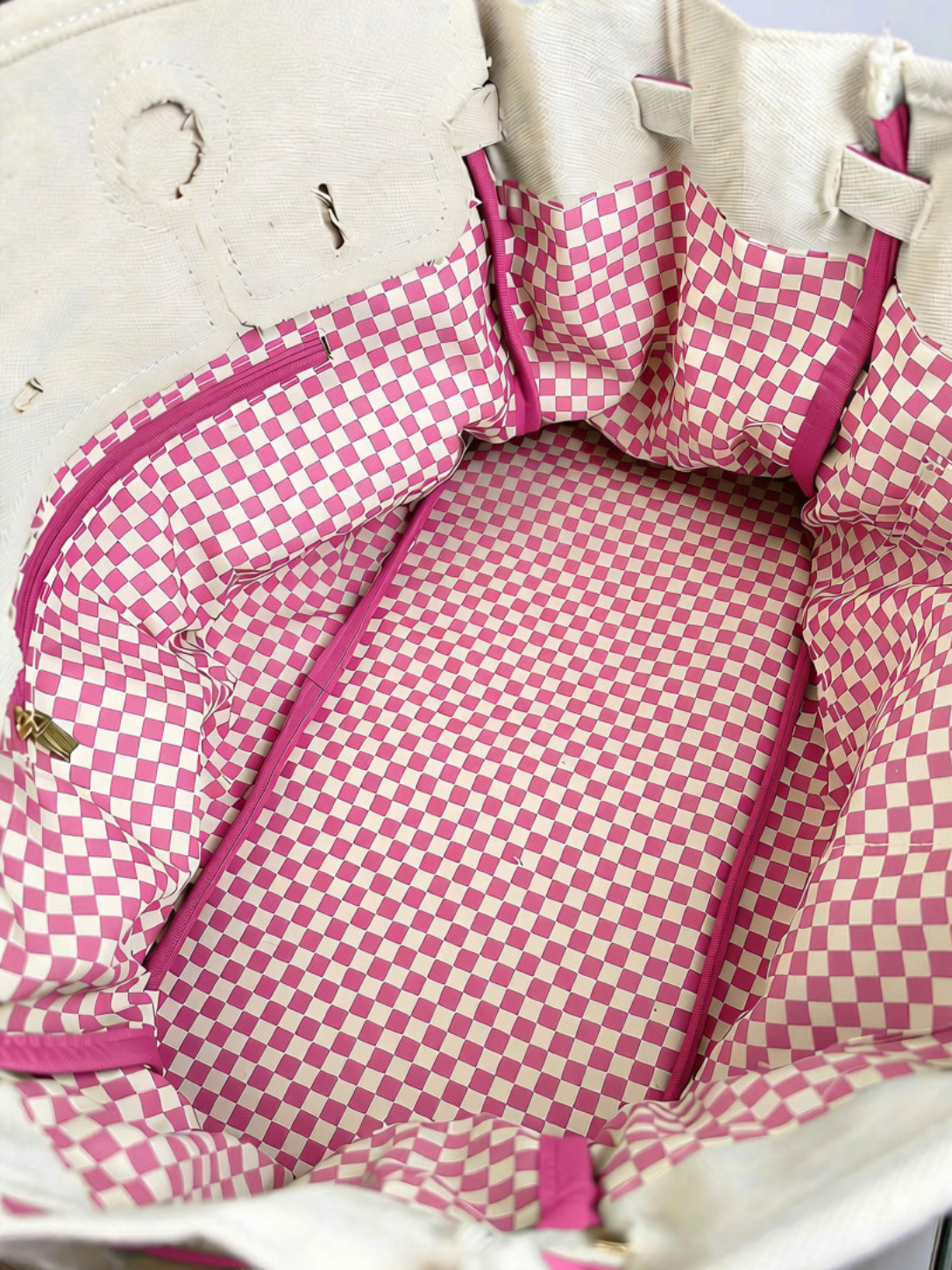 Interior of the Parker canvas boat tote featuring playful pink and white gingham lining and a spacious main compartment.