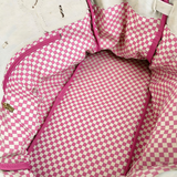 Interior of the Parker canvas boat tote featuring playful pink and white gingham lining and a spacious main compartment.