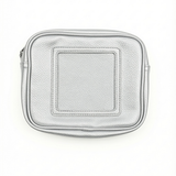 Stitch & Stow self-finishing needlepoint pouch in metallic silver with a textured exterior, zippered closure, and square 4-inch needlepoint insert.