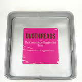 Silver metallic self-finishing needlepoint valet tray featuring a square needlepoint insert window, raised edges, and textured interior.