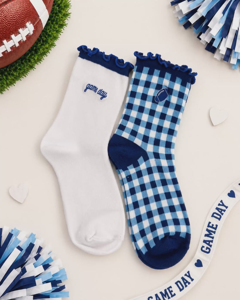 Animation video scrolling through the pep rally game day sock pairs highlighting all the colors on a fun white background with poms, a game day ribbon and football